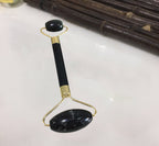 Jade roller and gua sha in use