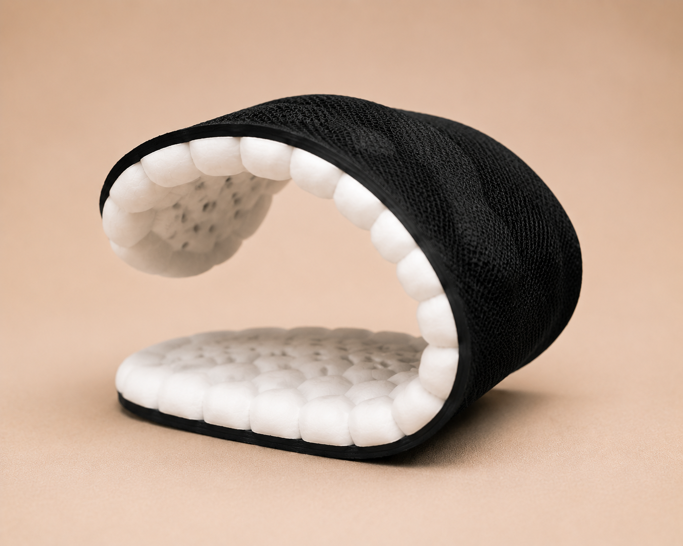 CloudStep insole bent by hand to show how the cushioning flexes