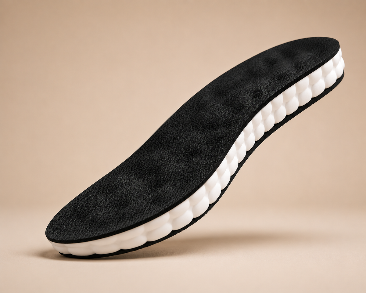 CloudStep cushioned insole seen from a three quarter angle with its white perforated underside visible