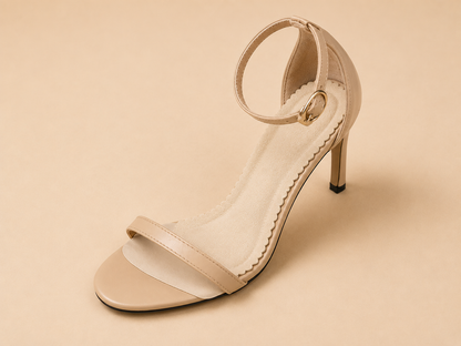 Beige HeelHold cushion pad positioned inside a women's heeled sandal, covering the forefoot and arch and ending before the heel