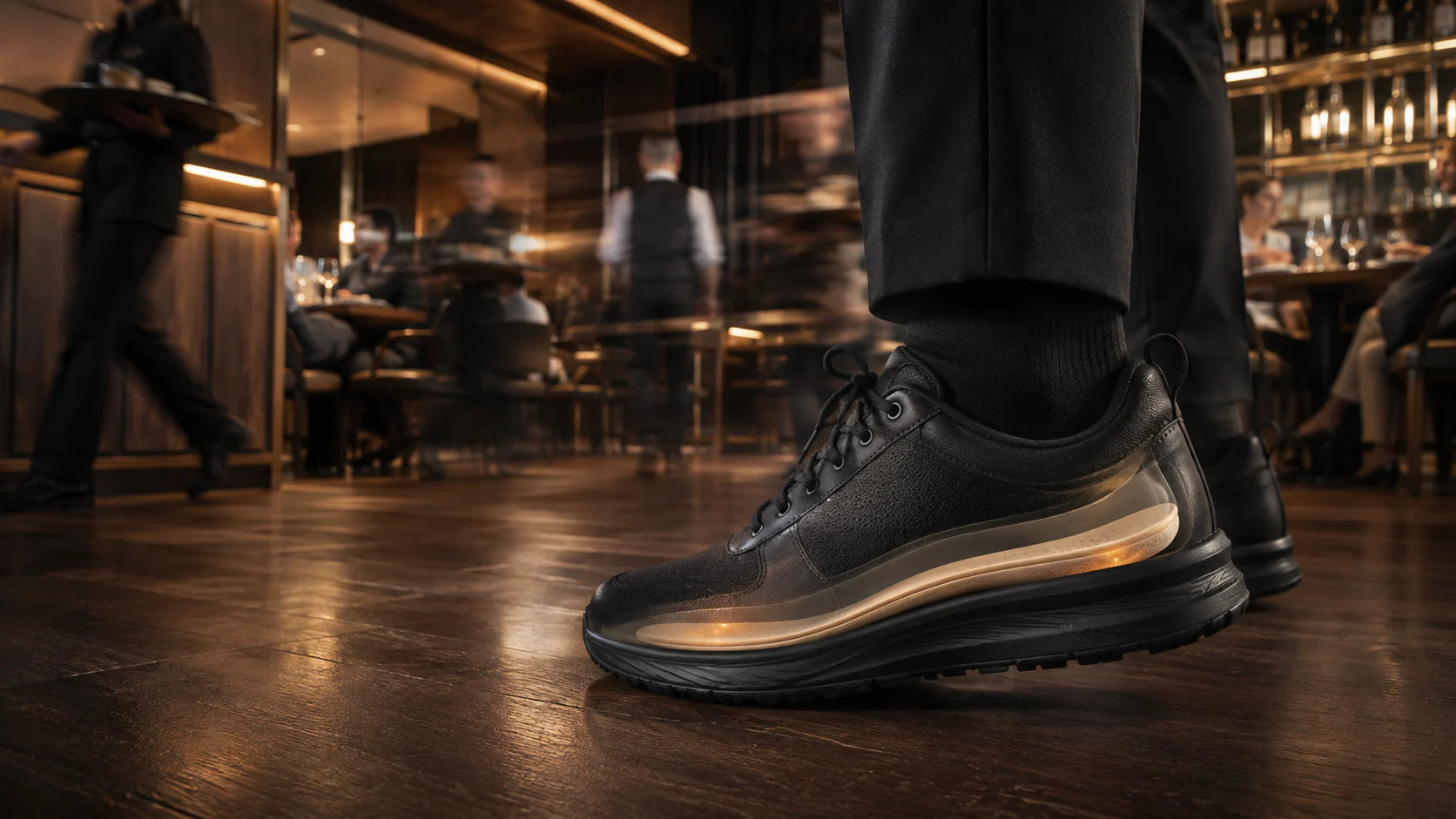 Hospitality worker wearing a sneaker shown in cutaway with an insole visible inside